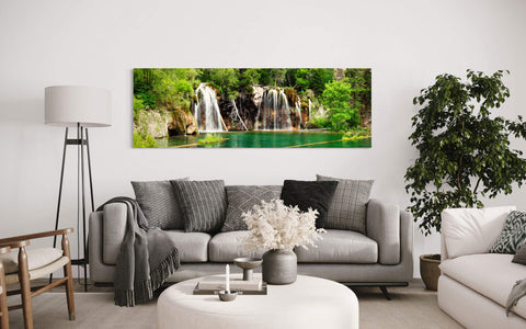 A waterfall picture of Hanging Lake in Colorado hangs in a living room.