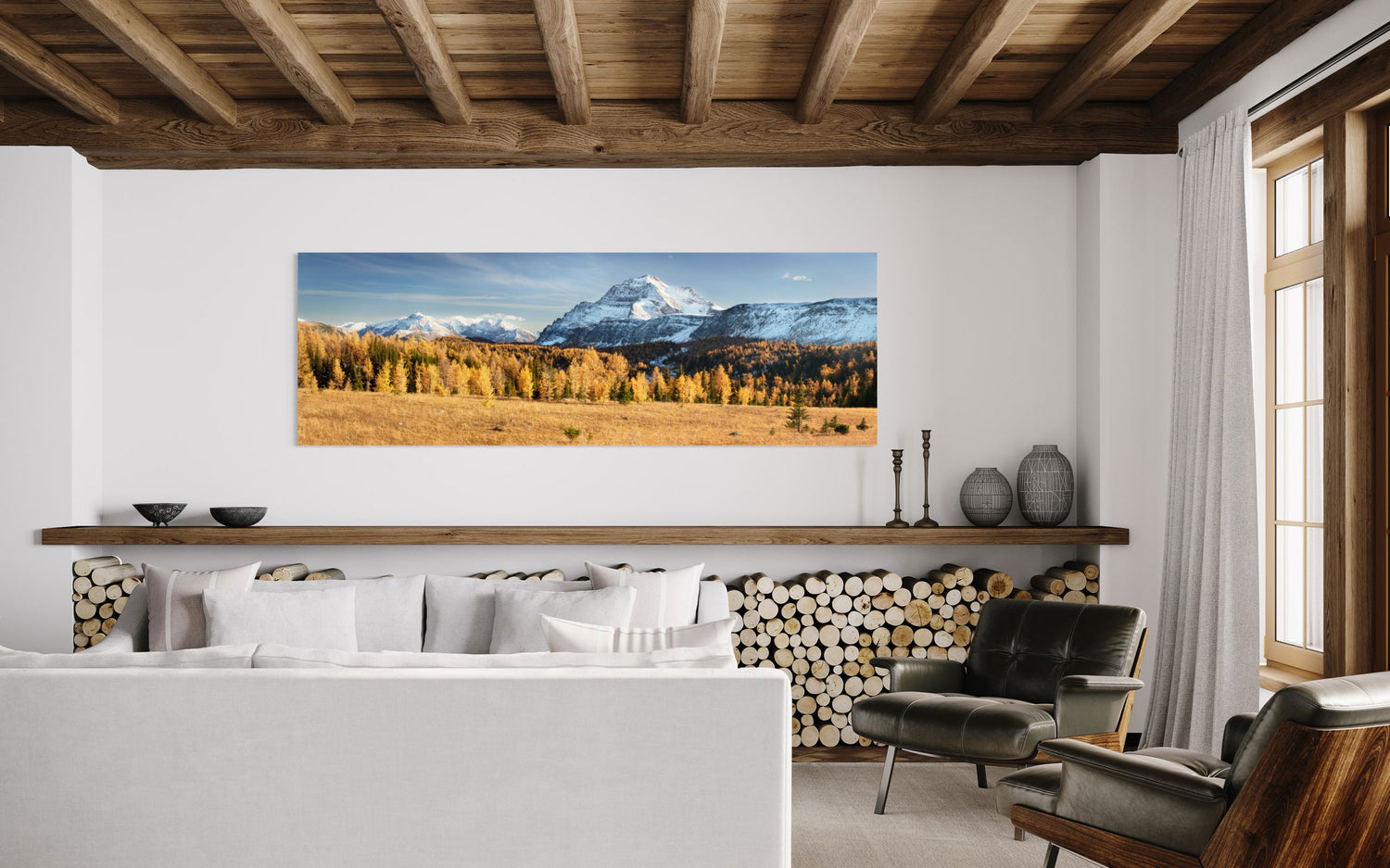 A piece of Banff art showing the larches on the Healy Pass hike in fall hangs in a living room.