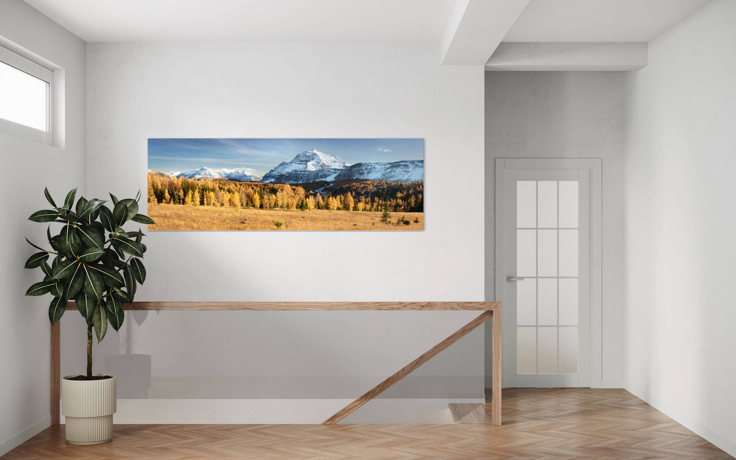 A picture of the golden larches on Healy Pass in Banff hangs in an entryway.