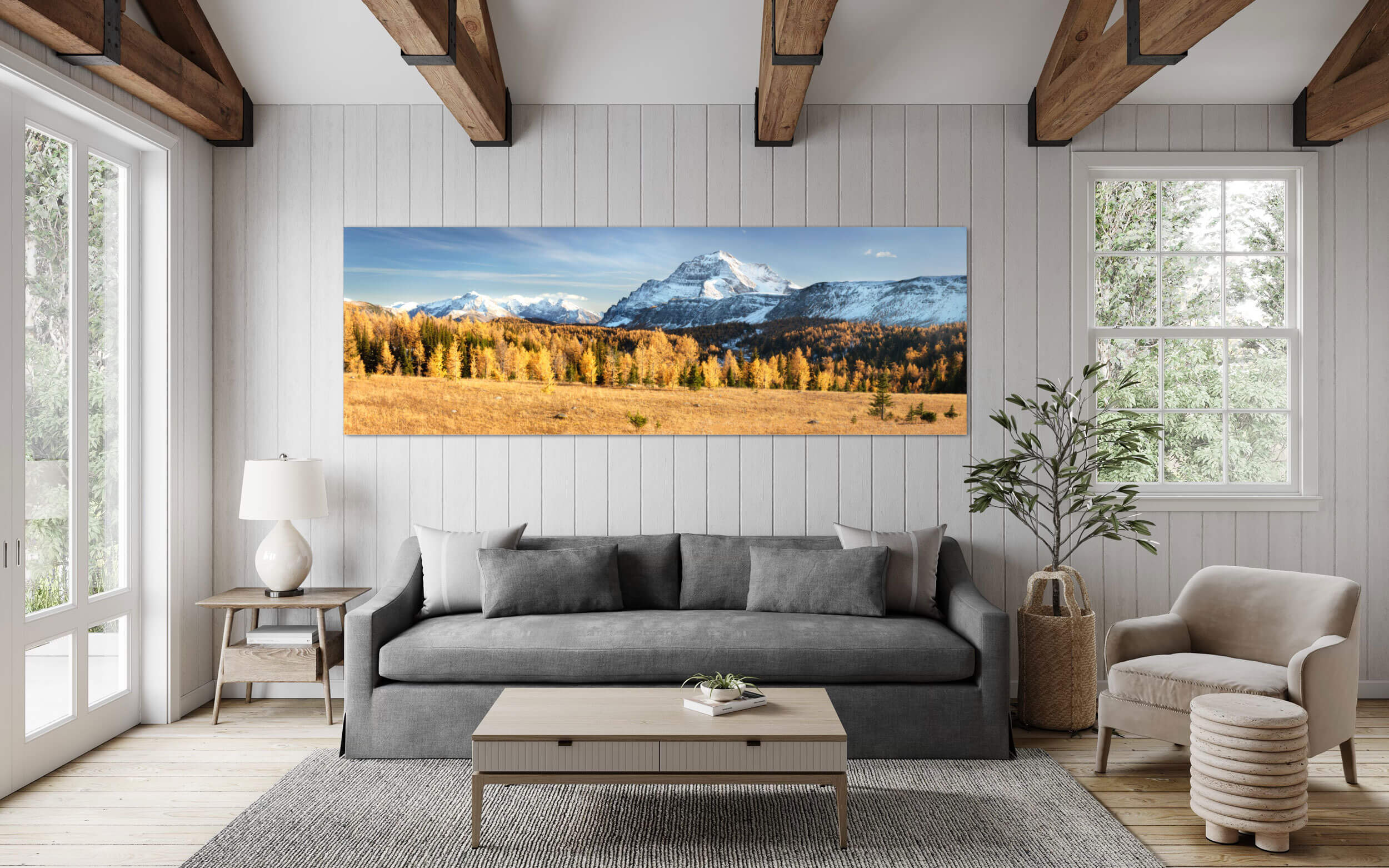 A picture of the golden larches on Healy Pass in Banff hangs in a living room.