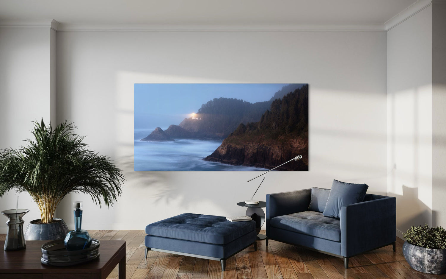 A piece of Oregon wall art showing Heceta Head Lighthouse hangs in a living room.