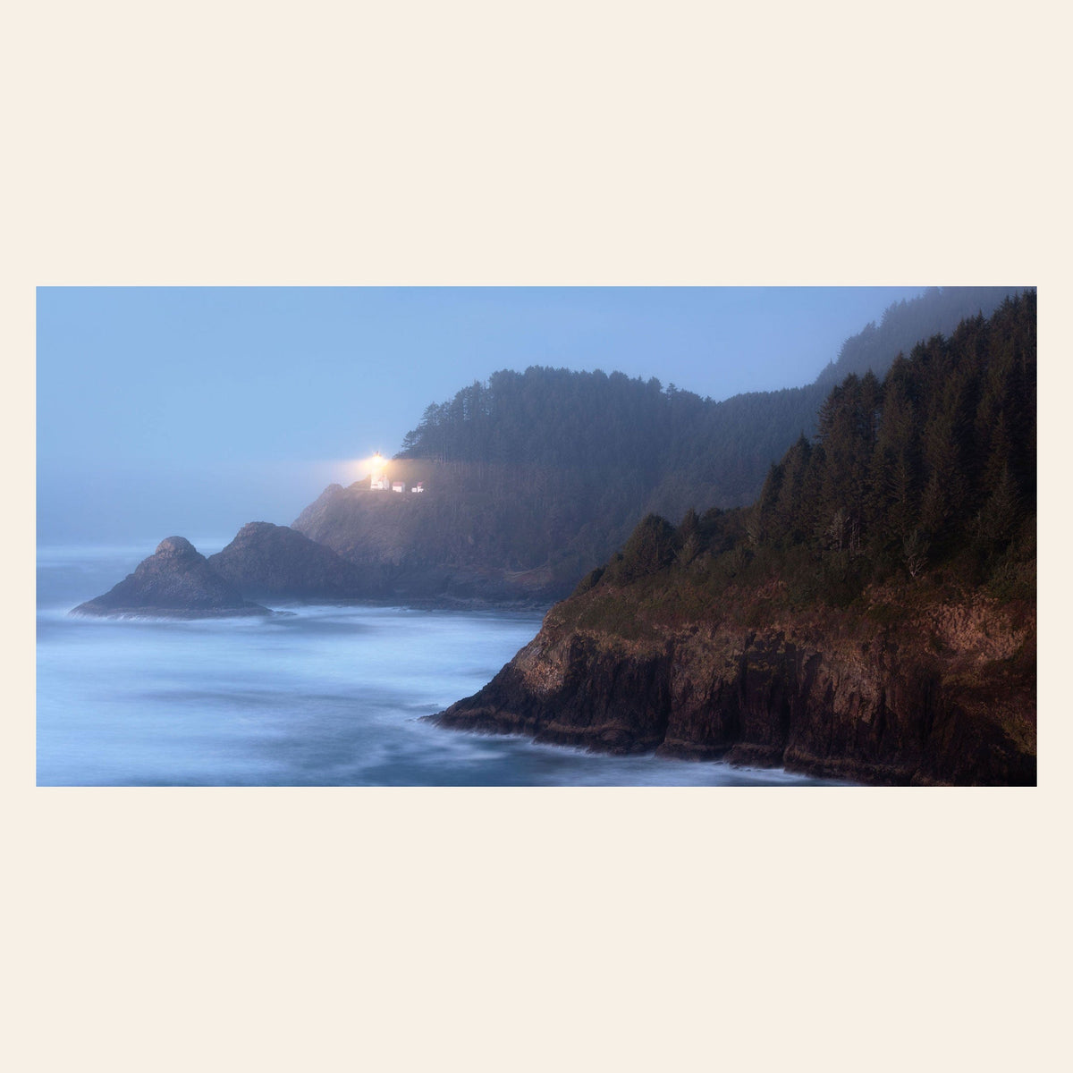 A piece of Oregon wall art shows Heceta Head Lighthouse.