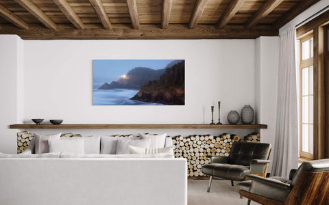 A lighthouse picture of Heceta Head on the Oregon Coast hangs in a living room.