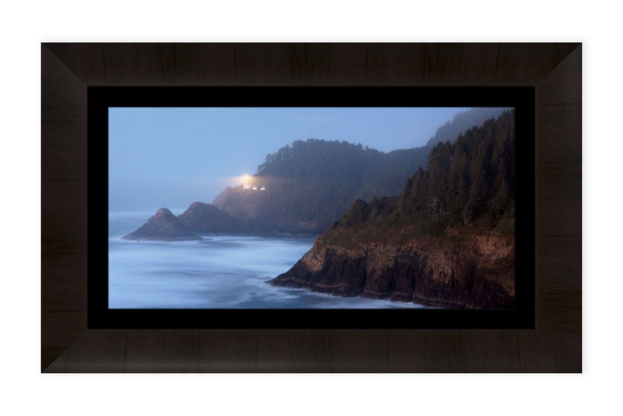 A framed lighthouse picture of Heceta Head on the Oregon Coast.