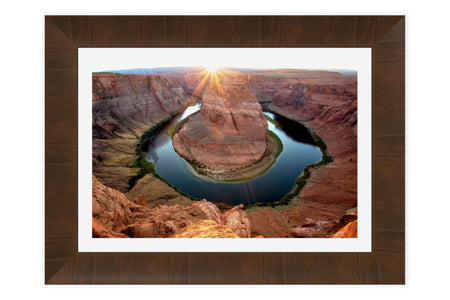 A framed Horseshoe Bend sunset picture.