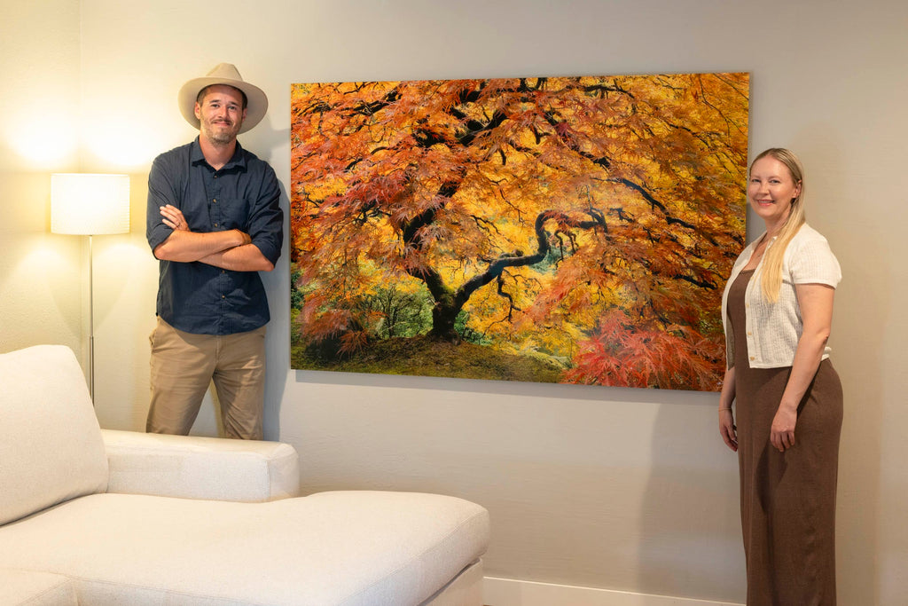 West Seattle artist Lars Gesing with a collector and his Japanese maple artwork GUARDIAN ANGEL.