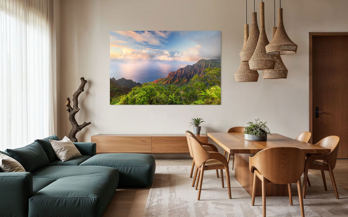 A piece of Kauai art showing a photo of sunset at the Napali Coast as seen from the Kalalau Valley Overlook hangs in a family room.