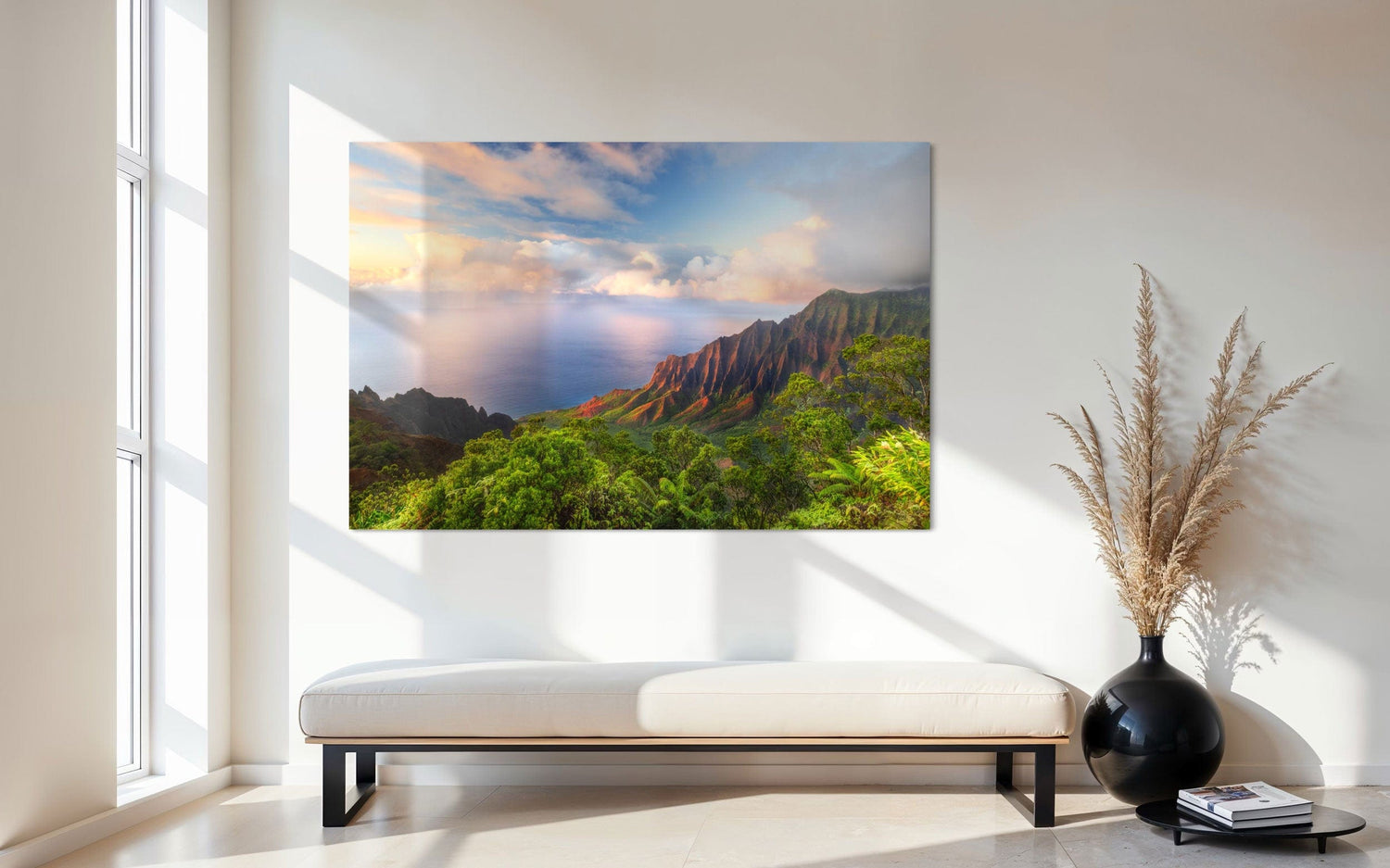 A piece of Kauai art showing a photo of sunset at the Napali Coast as seen from the Kalalau Valley Overlook hangs in an entryway.
