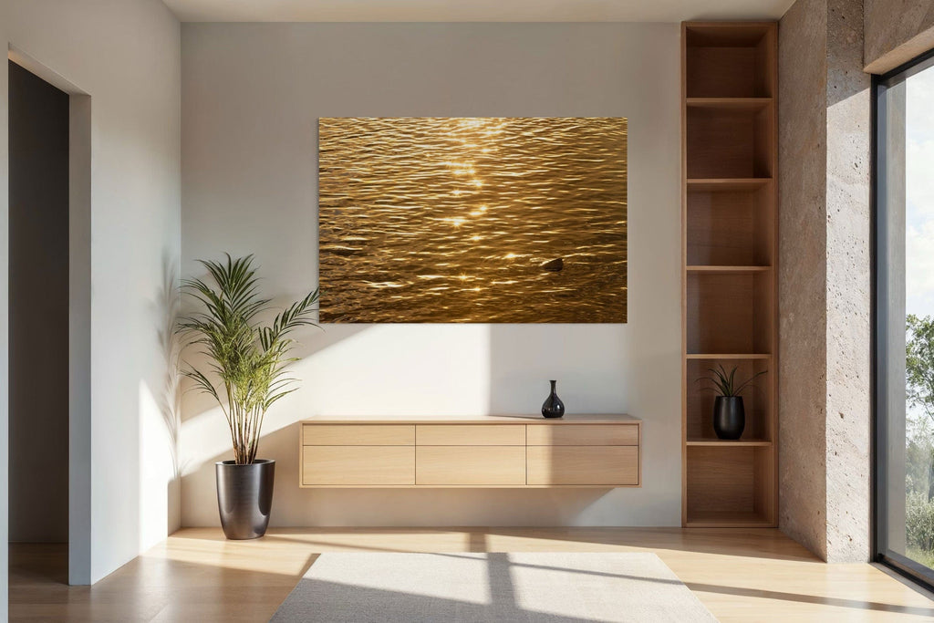 A piece of Kauai art showing a photo of a Kapaa sunrise reflected in the water hangs in an entryway.