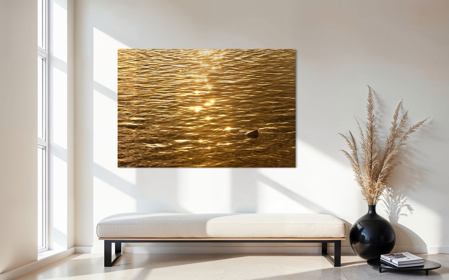 A piece of Kauai art showing a photo of a Kapaa sunrise reflected on the ocean hangs in an entryway.