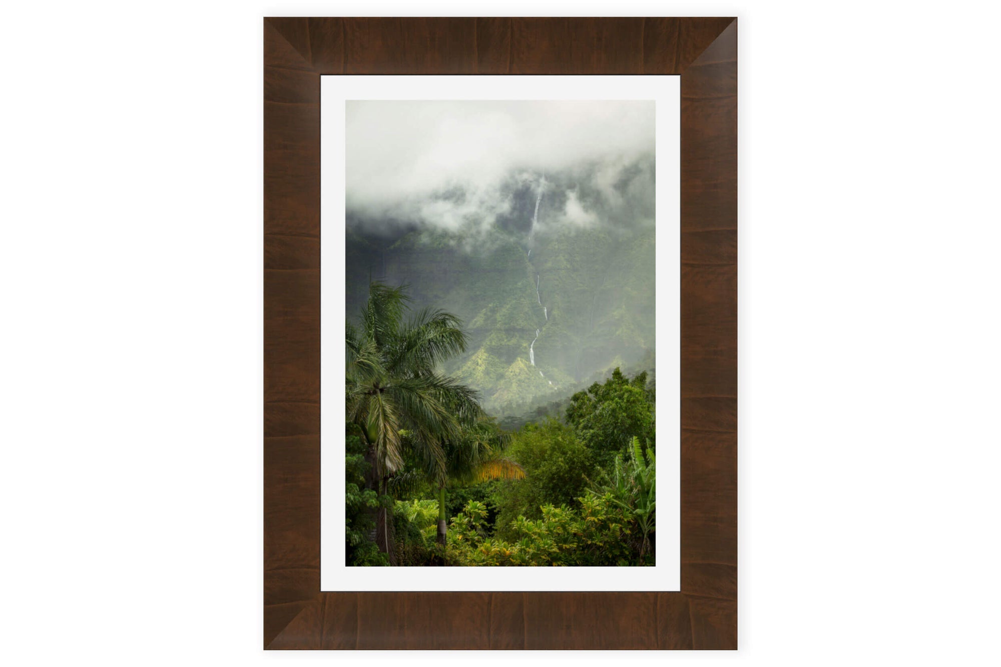 A piece of framed Kauai art shows a waterfall picture outside of Hanalei.