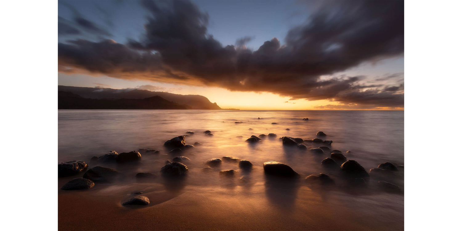 A sunset picture of Hanalei Bay on Kauai from Puu Poa Beach.
