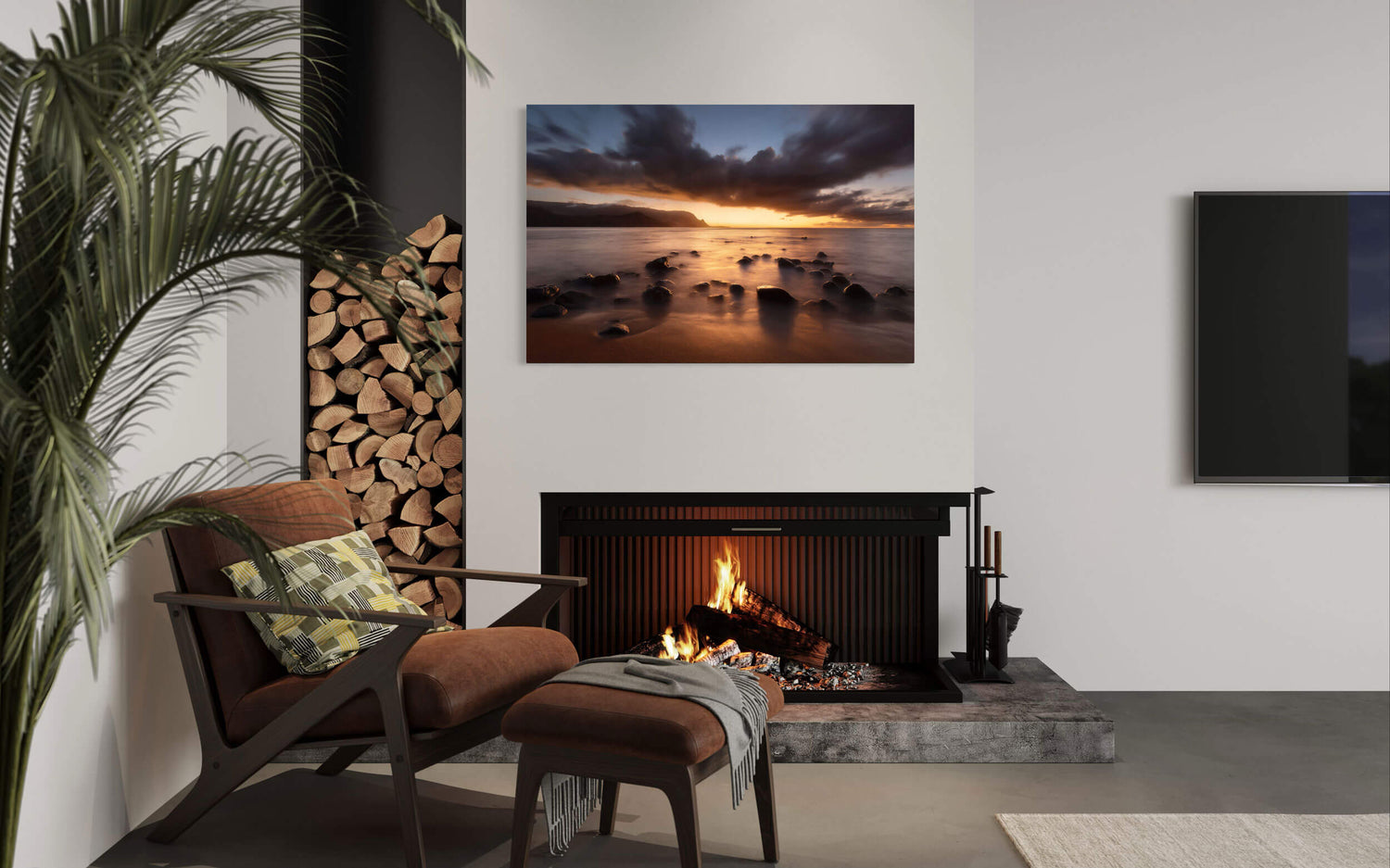 A piece of Kauai art showing a sunset picture of Hanalei Bay from Puu Poa Beach hangs in a living room.