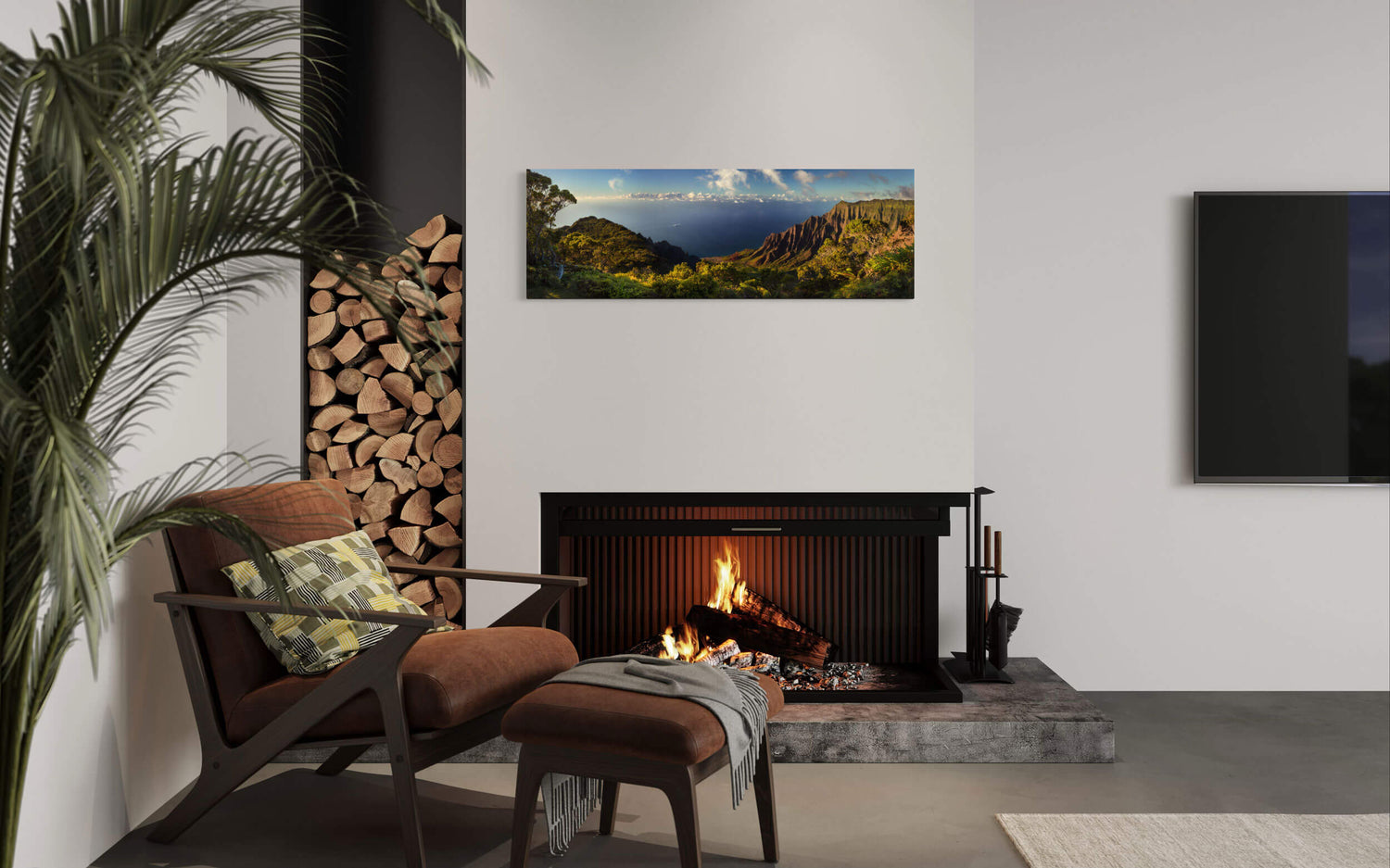 A piece of Kauai art showing the view from the Kalalau Overlook in Hawaii hangs in a living room.