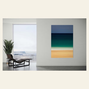 An abstract Kauai beach picture hangs in a living room.