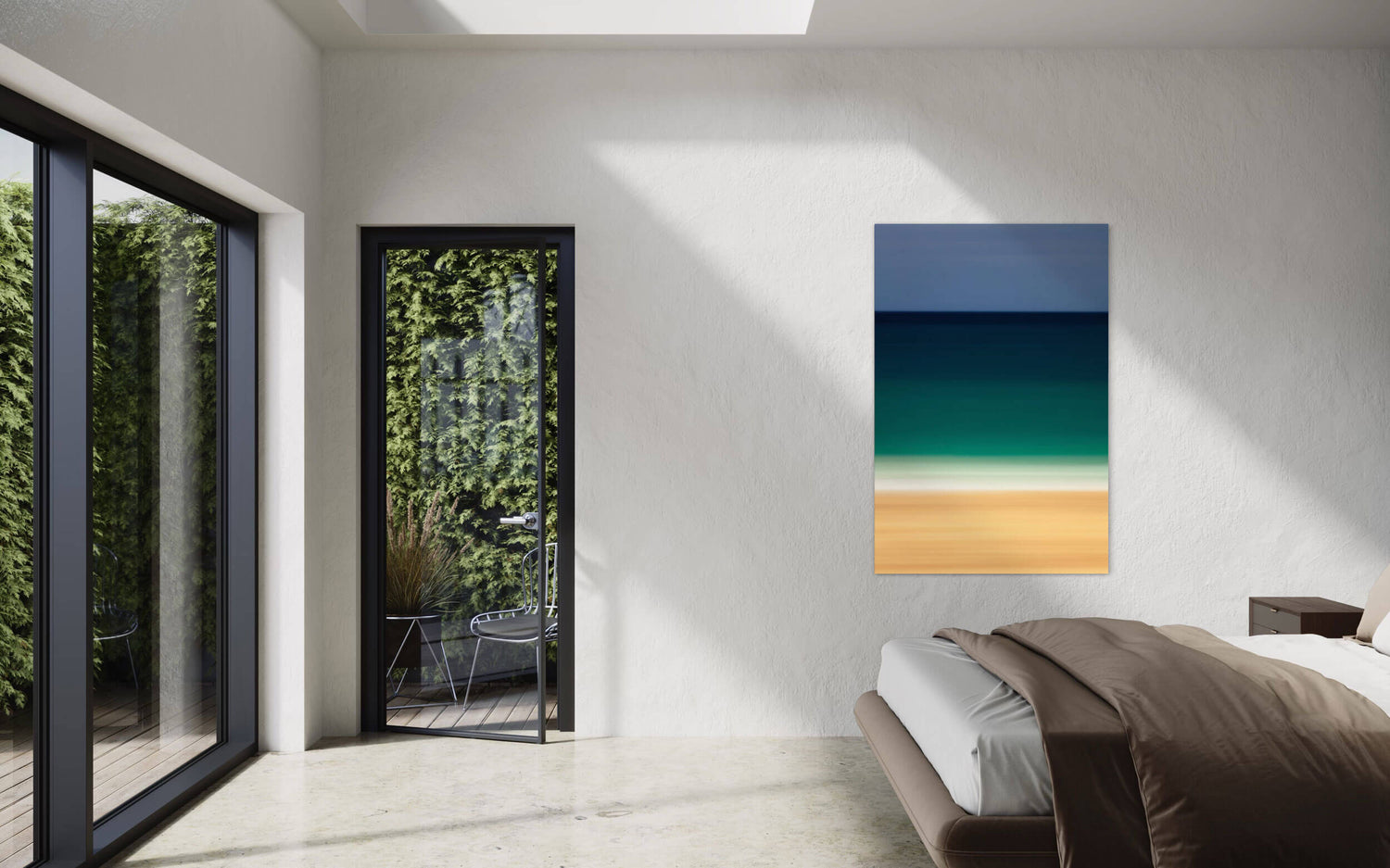 An abstract Kauai beach picture hangs in a living room.