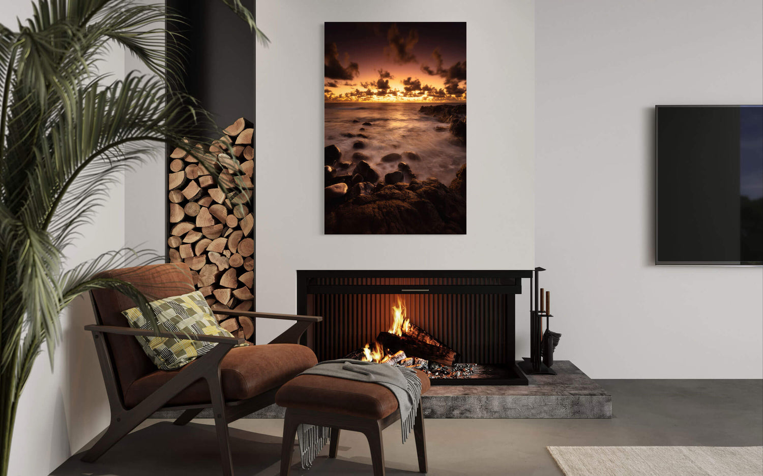 A piece of Kauai art showing a Kapaa sunrise picture hangs in a living room.