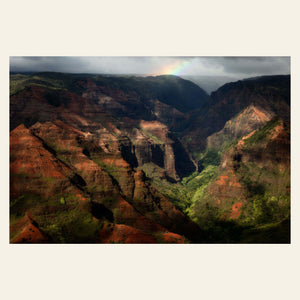 A picture of Waimea Canyon on Kauai with a rainbow.