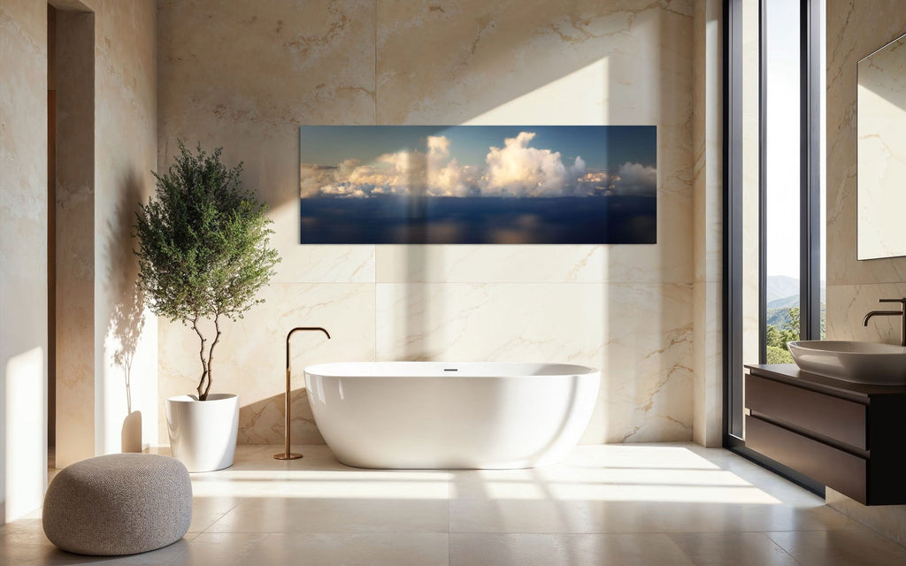 A piece of Kauai art showing a photo of clouds along the Napali Coast hangs in a bathroom.