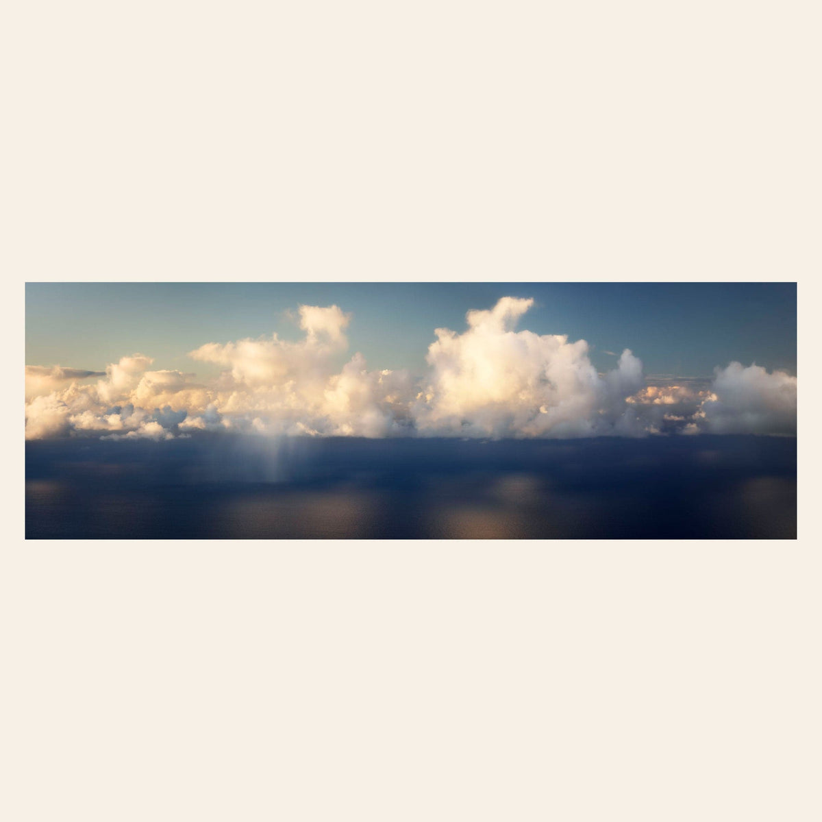 A piece of Kauai art shows a photo of clouds along the Napali Coast.