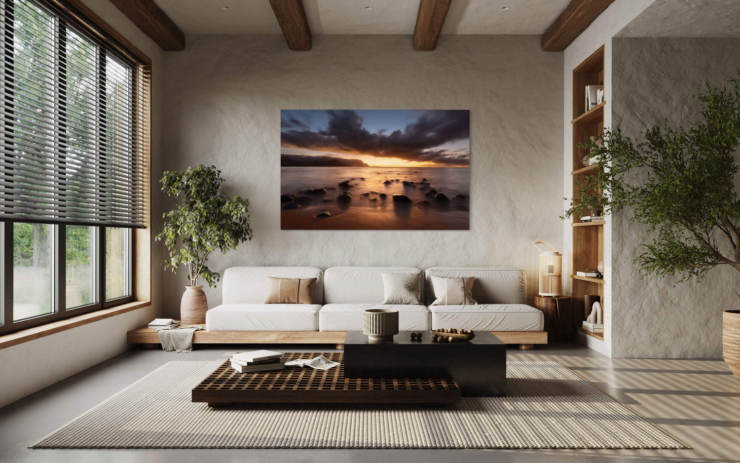 A piece of Kauai art showing a sunset picture of Hanalei Bay hangs in a living room.