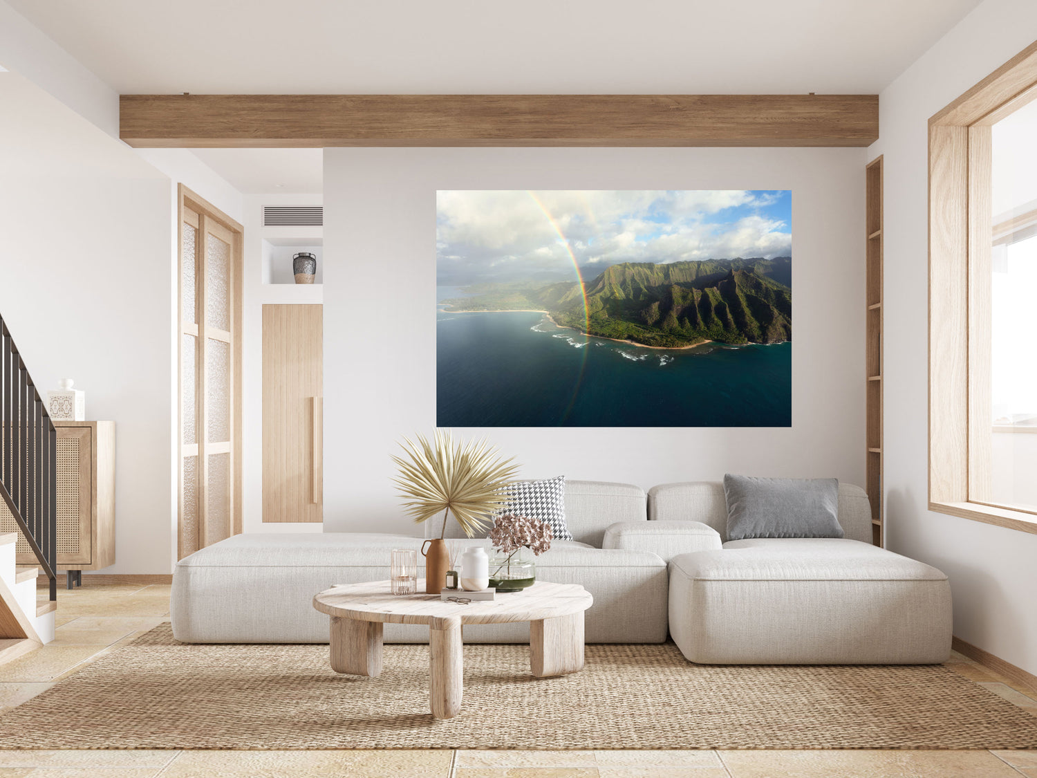 A piece of Napali Coast wall art created on a Kauai helicopter tour hangs in a living room.