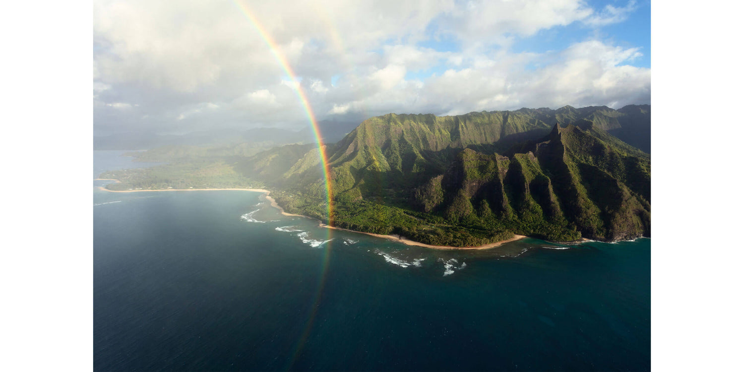 A Napali Coast picture with a double rainbow created on a Kauai helicopter tour.