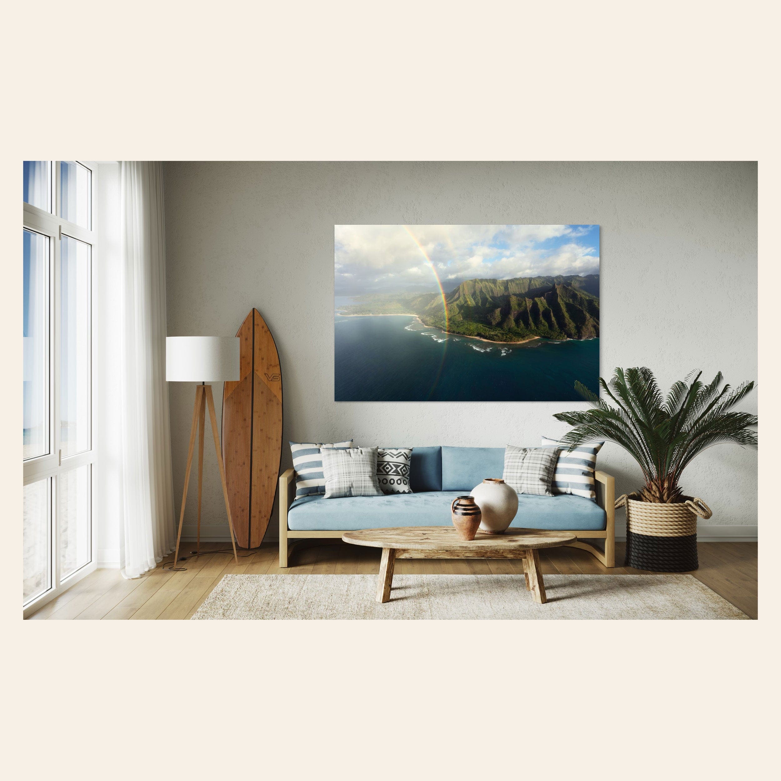 A piece of Napali Coast wall art created on a Kauai helicopter tour hangs in a living room.