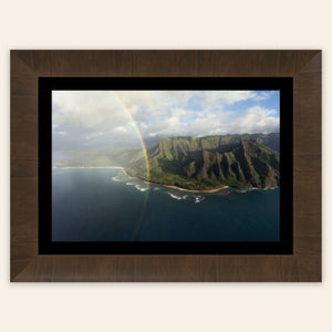 A framed piece of Napali Coast wall art created on a Kauai helicopter tour.