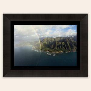 A framed piece of Napali Coast wall art created on a Kauai helicopter tour.