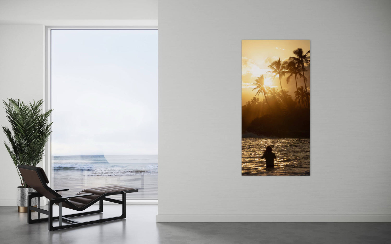 A Kauai sunset picture from the Coconut Coast hangs in a living room.