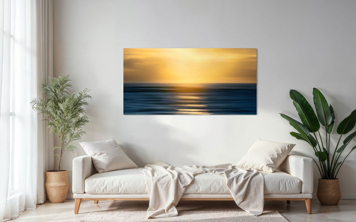 A piece of art showing one of the many good Kauai sunsets hangs above a chaise lounge.