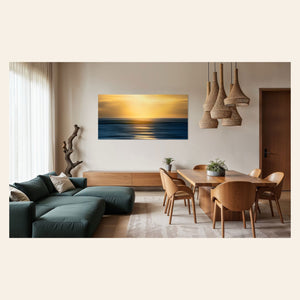 A piece of art showing one of the many good Kauai sunsets hangs in a family room.