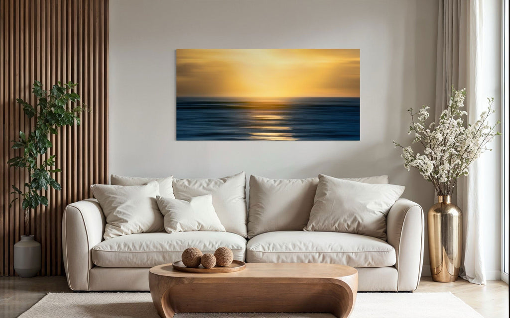 A piece of art showing one of the many good Kauai sunsets hangs over a sofa.