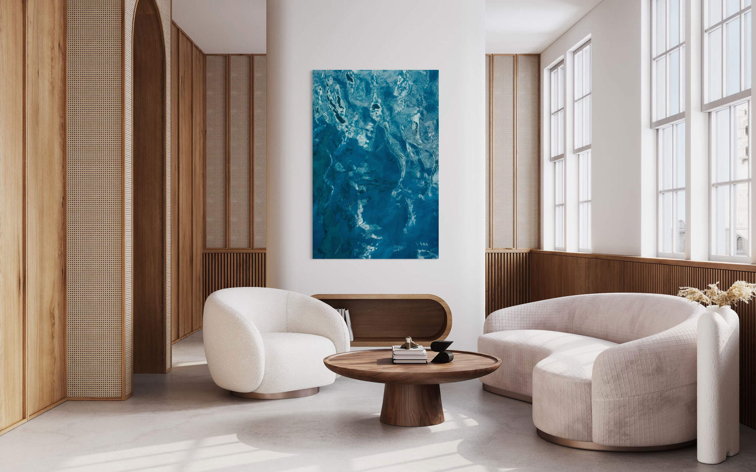 A Kauai picture of the beautiful ocean colors hangs in a living room.