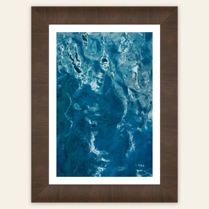 A framed Kauai picture of the beautiful ocean colors.