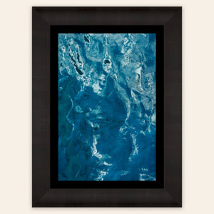 A framed Kauai picture of the beautiful ocean colors.