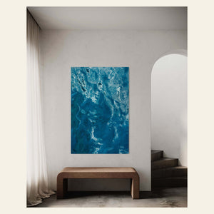 A Kauai picture of the beautiful ocean colors hangs in a hallway.