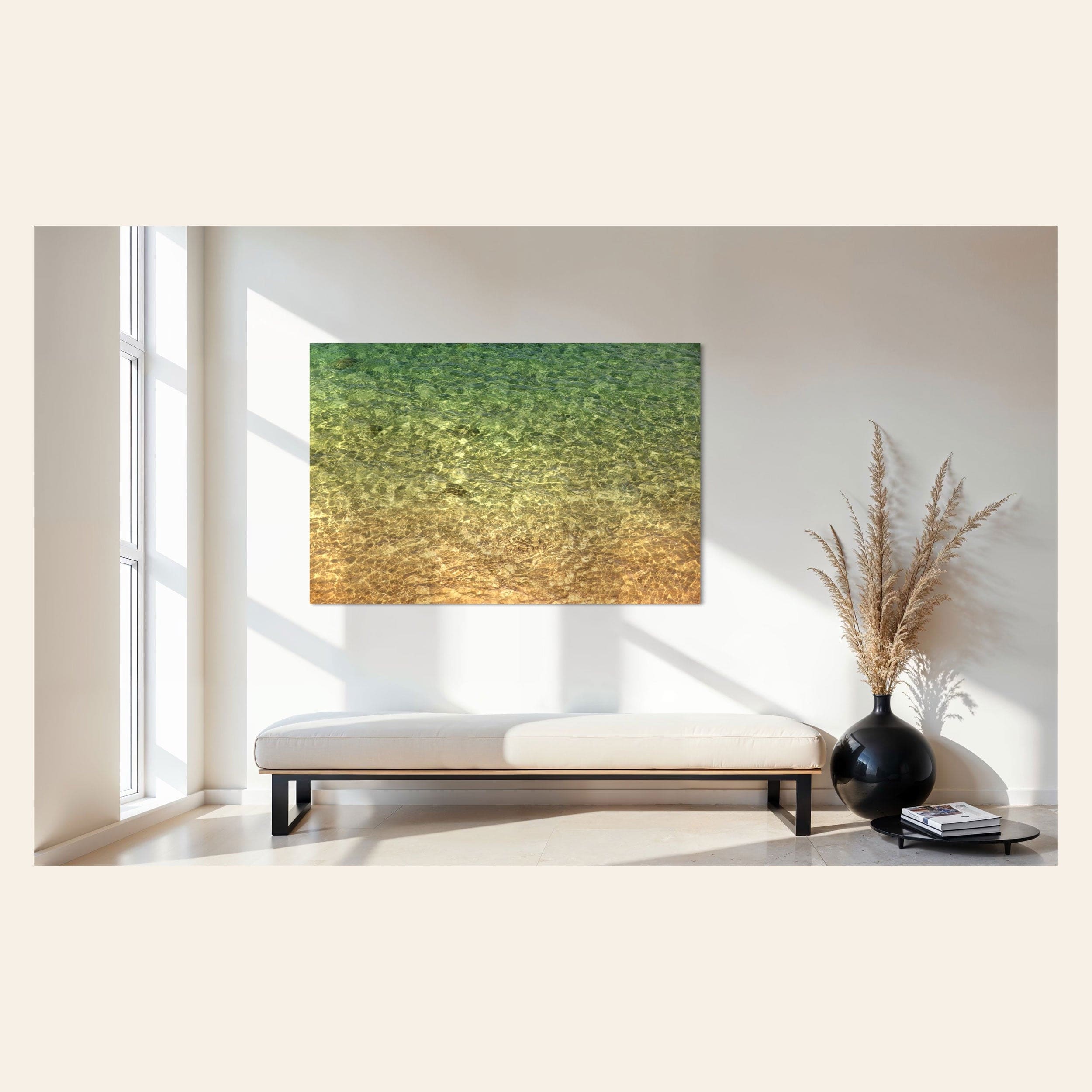 A piece of Kauai art showing the colors of the water on the ocean surface hangs in an entryway.