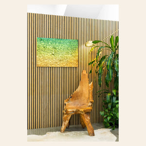 A piece of Kauai art by Lars Gesing shows the colors of the water on the ocean surface.