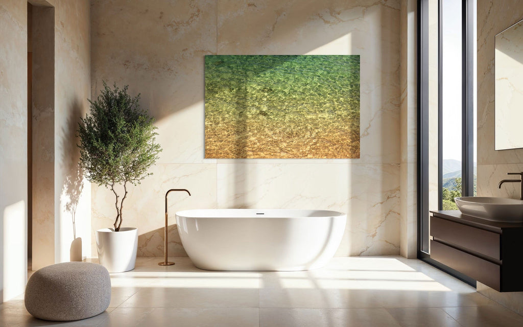 A piece of Kauai art showing the colors of the water on the ocean surface hangs in a bathroom.