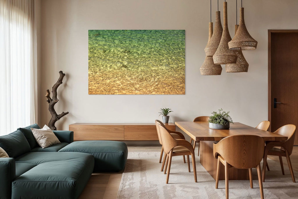 A Lars Gesing Fine Art coastal artwork hangs in a modern organic living room.