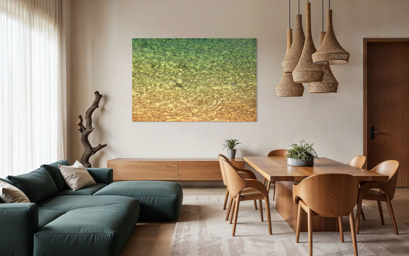 A piece of Kauai art showing the colors of the water on the ocean surface hangs in a family room.