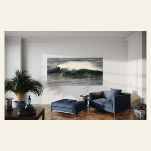 A wave picture from Shipwreck Beach in Poipu, Kauai hangs in a living room.
