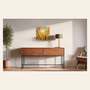 A piece of Colorado art showing a Kenosha Pass peak fall color photo hangs over a console.