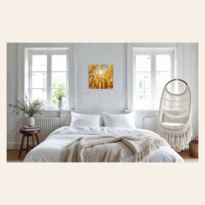 A piece of Colorado art showing a Kenosha Pass peak fall color photo hangs above a bed.