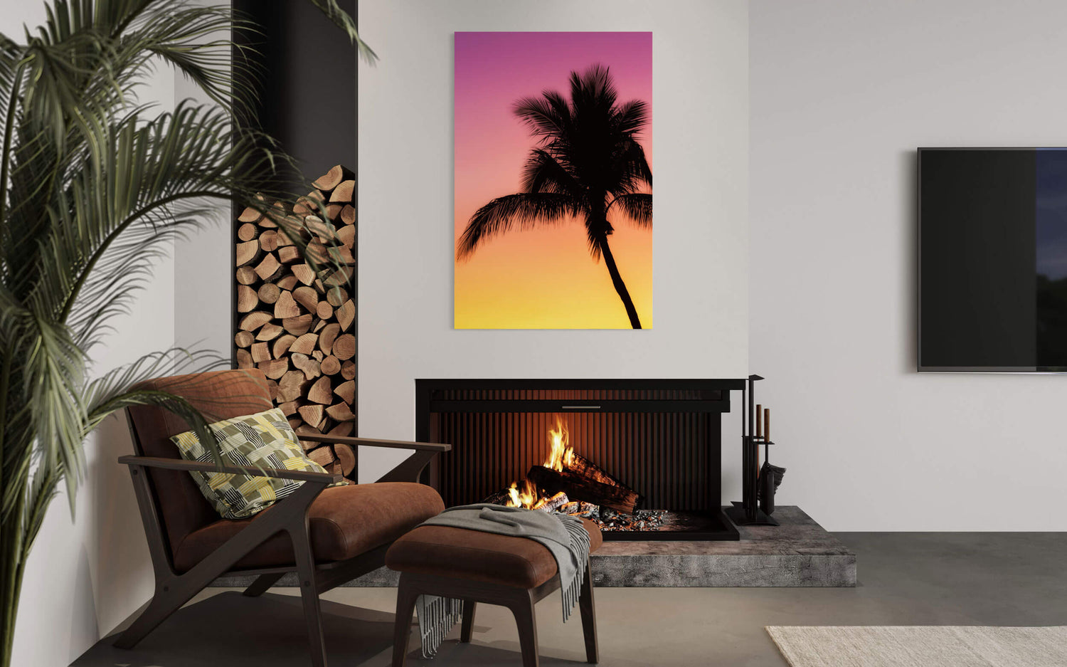 A Key West sunset picture with a palm tree hangs in a living room.