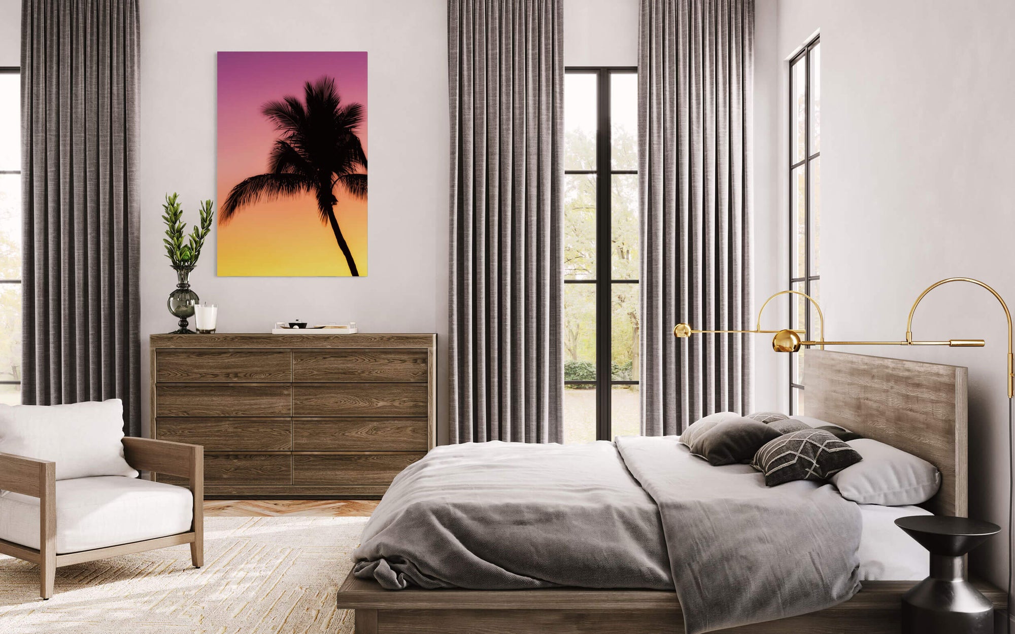 A Key West sunset picture with a palm tree hangs in a bedroom.