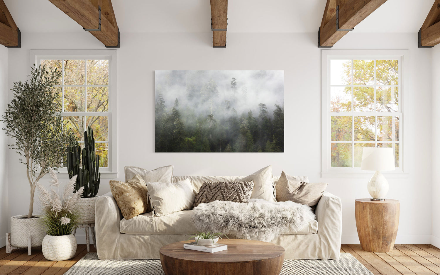 A piece of Washington wall art showing the Lake Quinault rainforest hangs in a living room.