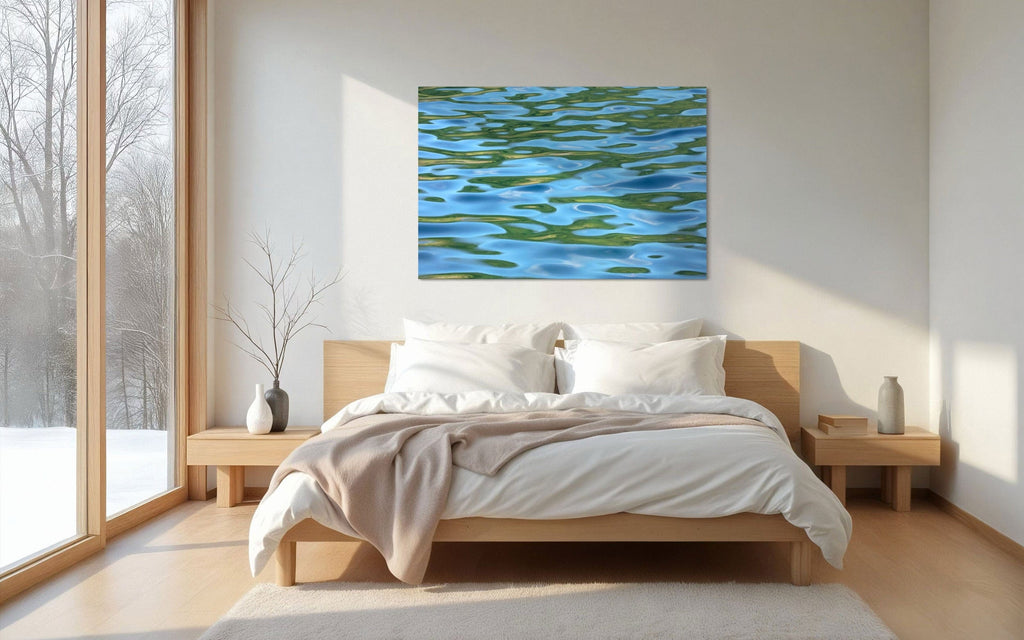 A piece of Washington art showing a Lake Sutherland photo hangs in a bedroom.